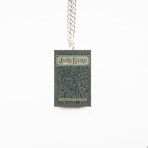 Book-shaped pendant with 'Jane Eyre' on a chain against a white background