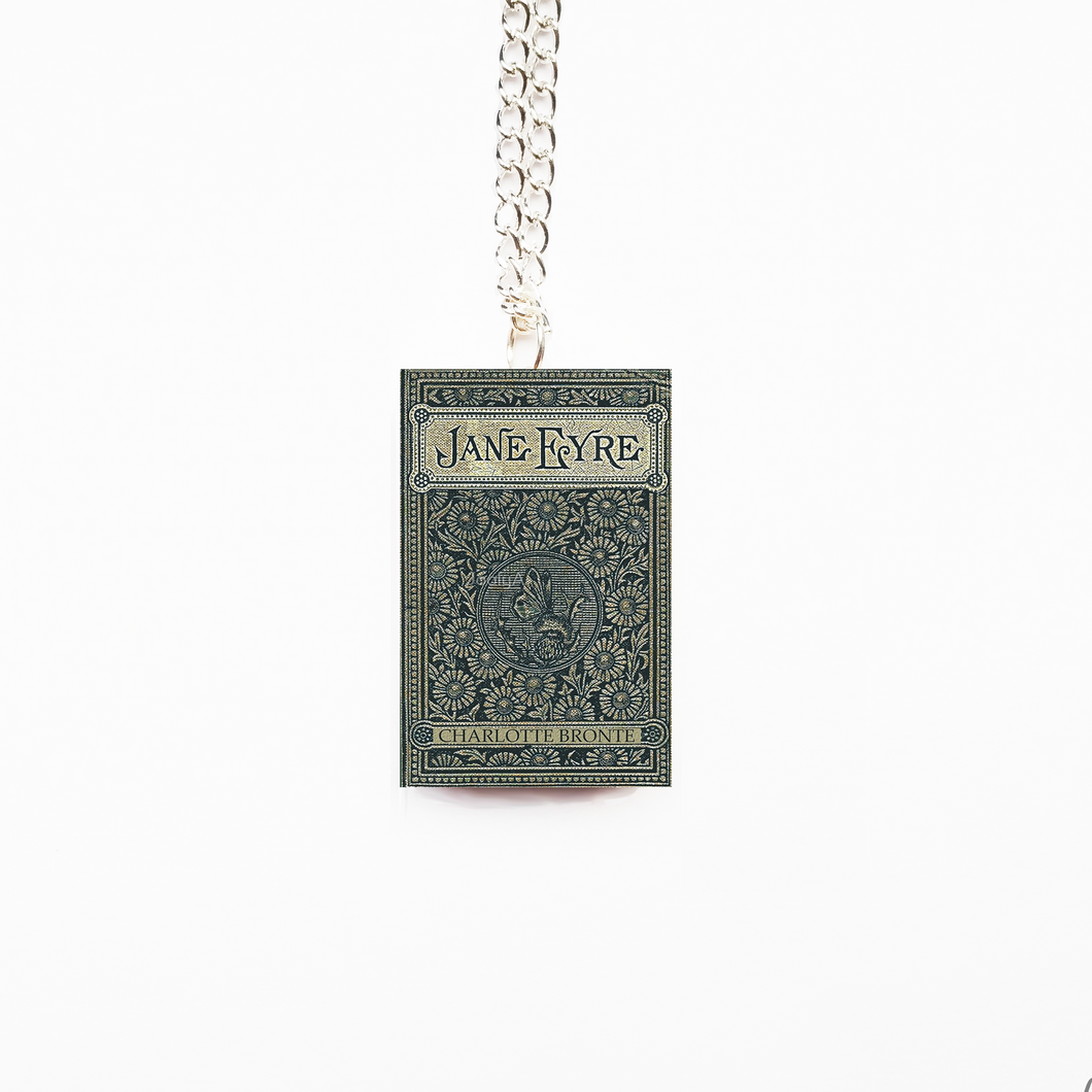 Book-shaped pendant with 'Jane Eyre' on a chain against a white background