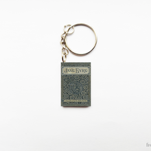 Load image into Gallery viewer, Keychain shaped like a book titled &#39;Jane Eyre&#39; on a white background