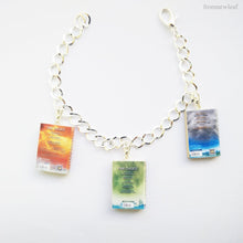 Load image into Gallery viewer, Three Divergent back book series miniature book charm bracelet