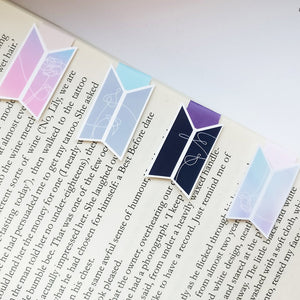 Four BTS Logo Love Yourself themed magnetic bookmark on book page
