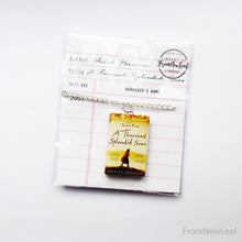 Load image into Gallery viewer, A Thousand Splendid Suns Miniature book necklace packaged in library card