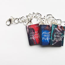 Load image into Gallery viewer, Three A Court of Thorns and Roses set miniature book on a charm bracelet