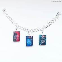 Load image into Gallery viewer, Three A Court of Thorns and Roses series miniature books on a charm bracelet