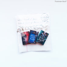 Load image into Gallery viewer, Three A Court of Thorns and Roses set miniature book charm bracelet packaged in library card