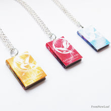 Load image into Gallery viewer, The Hunger Games, Catching Fire, Mockingjay Flaming Edition Miniature Book Necklace side view