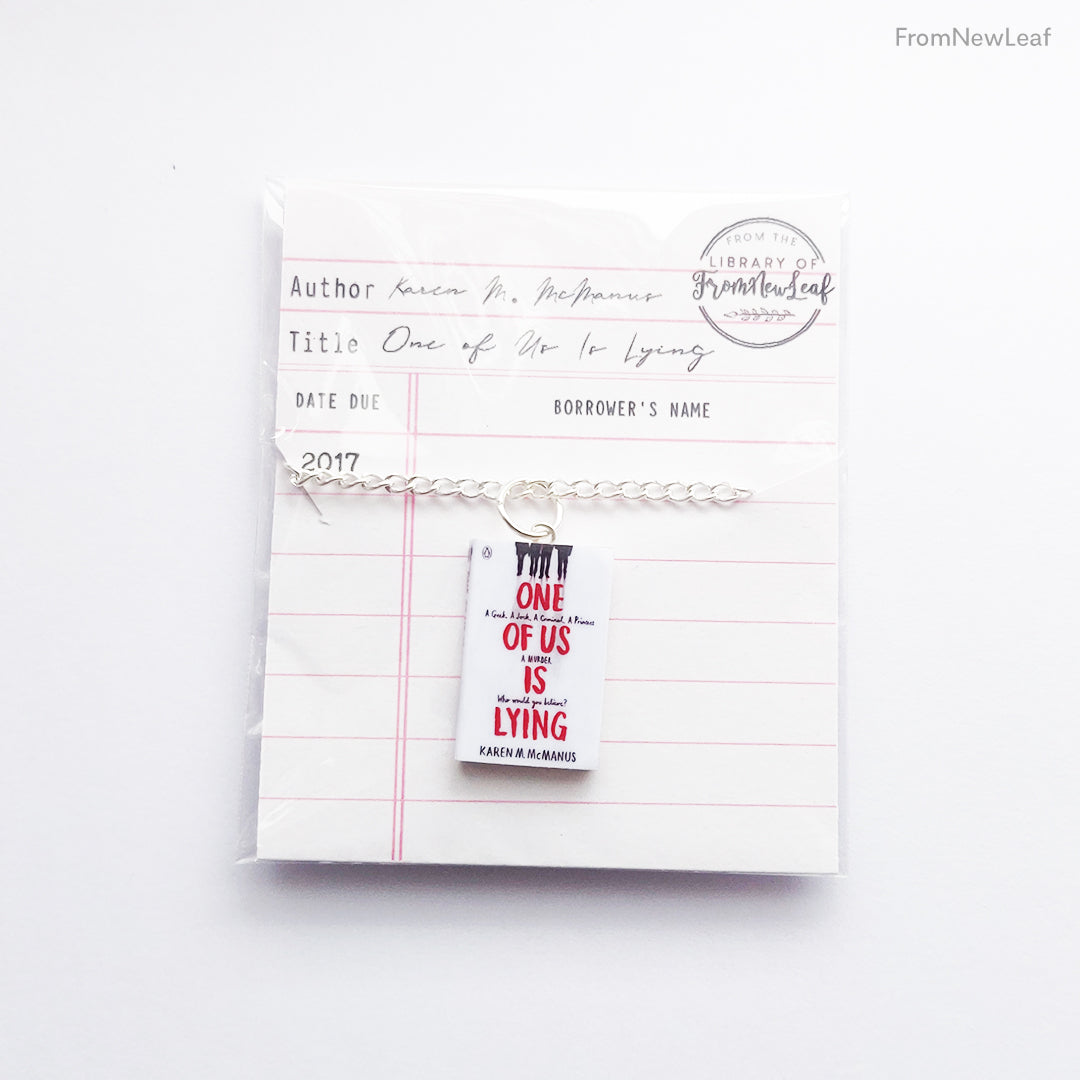 Load image into Gallery viewer, One of us is Lying Miniature Book Necklace Keychain
