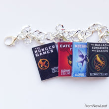Load image into Gallery viewer, The Hunger Games, Catching Fire, Mockingjay, The Ballad of Songbirds and Snakes miniature book charm bracelet